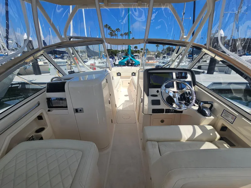 Slide: The Image of Interior of a 2022 Grady-White Freedom 275 boat at the marina. - 36