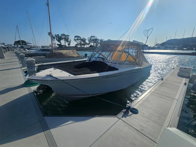 Slide: The Image of Grady-White Freedom 275 boat, 2022, docked in sunny marina. - 37