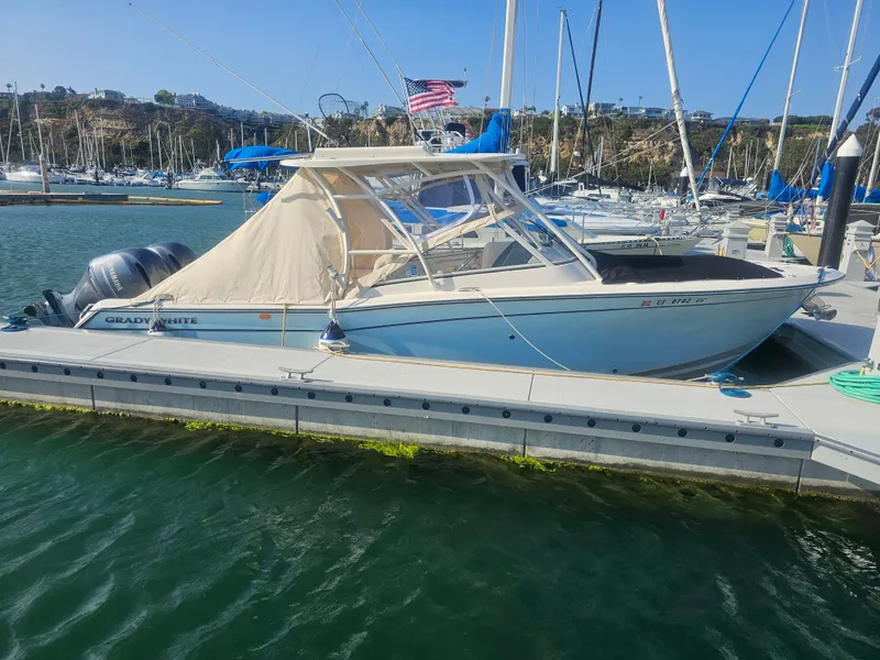 Slide: The Image of 2022 Grady-White Freedom 275 boat docked in harbor. - 39