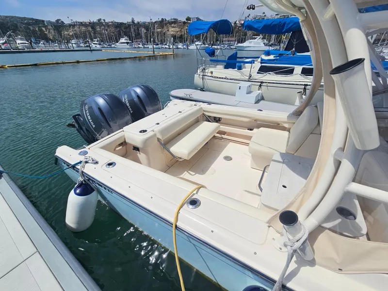 Slide: The Image of 2022 Grady-White Freedom 275 boat docked at marina. - 4