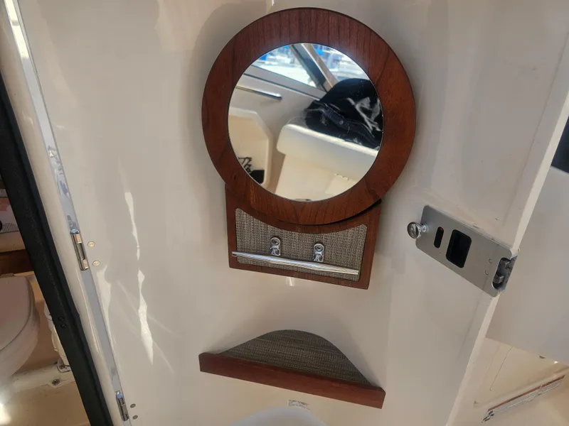 Slide: The Image of Interior of Grady-White Freedom 275 with round mirror, 2022 model. - 45