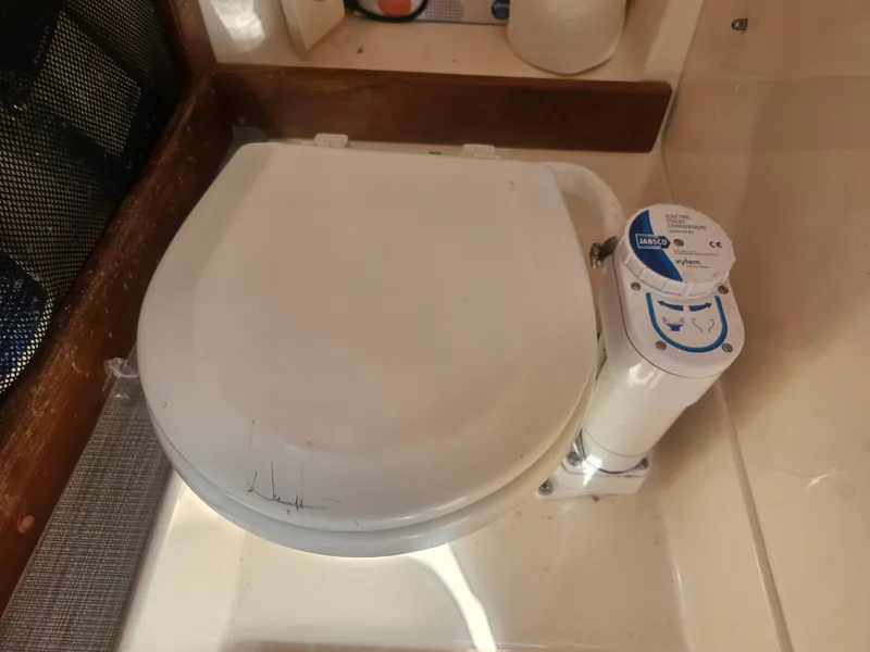 Slide: The Image of Marine toilet on a 2022 Grady-White Freedom 275 boat. - 46
