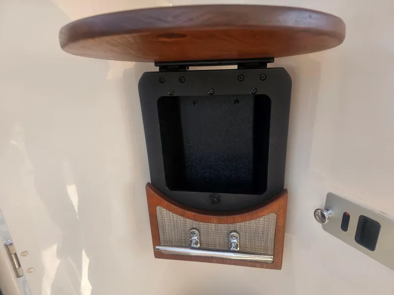 Slide: The Image of Interior view of a 2022 Grady-White Freedom 275 boat with wood accents. - 47