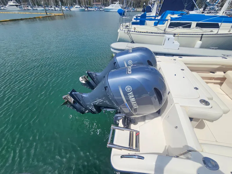 Slide: The Image of Grady-White Freedom 275 boat with Yamaha outboard engines, 2022 model in harbor. - 5