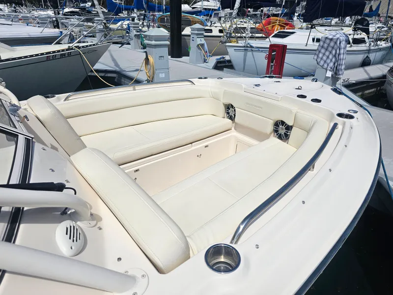 Slide: The Image of 2022 Grady-White Freedom 275 with luxurious seating area in marina. - 7