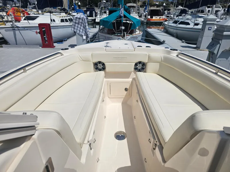 Slide: The Image of Interior view of 2022 Grady-White Freedom 275 boat at the marina. - 8