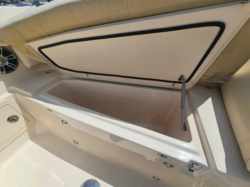 Slide: The Image of Open storage compartment on a 2022 Grady-White Freedom 275 boat. - 9