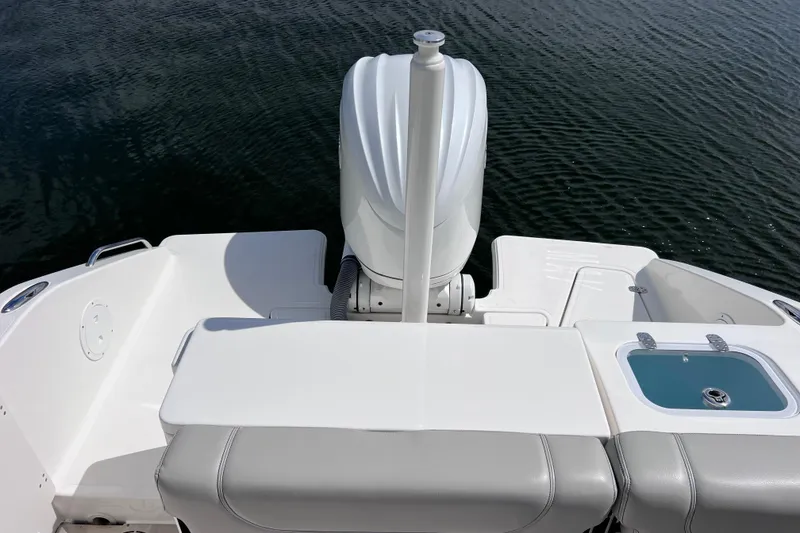 Slide: The Image of 2022 Pursuit DC 246 Dual Console boat with outboard motor on calm water. - 18