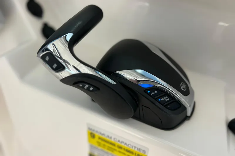 Slide: The Image of Throttle control of 2022 Pursuit DC 246 Dual Console boat, featuring sleek design and controls. - 39