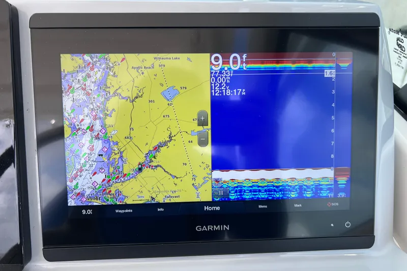 Slide: The Image of Garmin marine display on 2022 Pursuit DC 246 Dual Console, showing navigation and sonar data. - 41