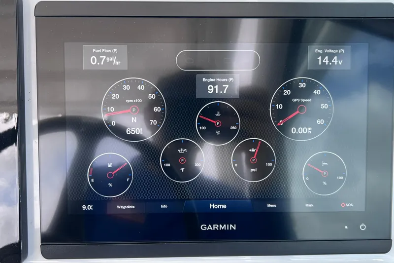 Slide: The Image of Garmin display on 2022 Pursuit DC 246 Dual Console showing engine metrics and GPS speed. - 44