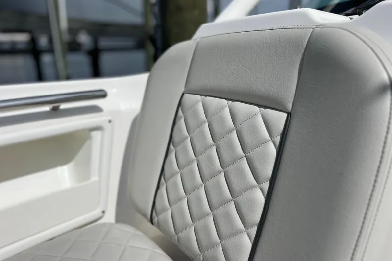 Slide: The Image of Luxurious seating detail on 2022 Pursuit DC 246 Dual Console boat. - 55