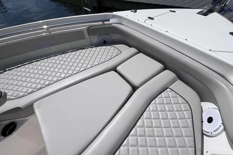 Slide: The Image of 2022 Pursuit DC 246 Dual Console boat with luxurious quilted seating. - 58