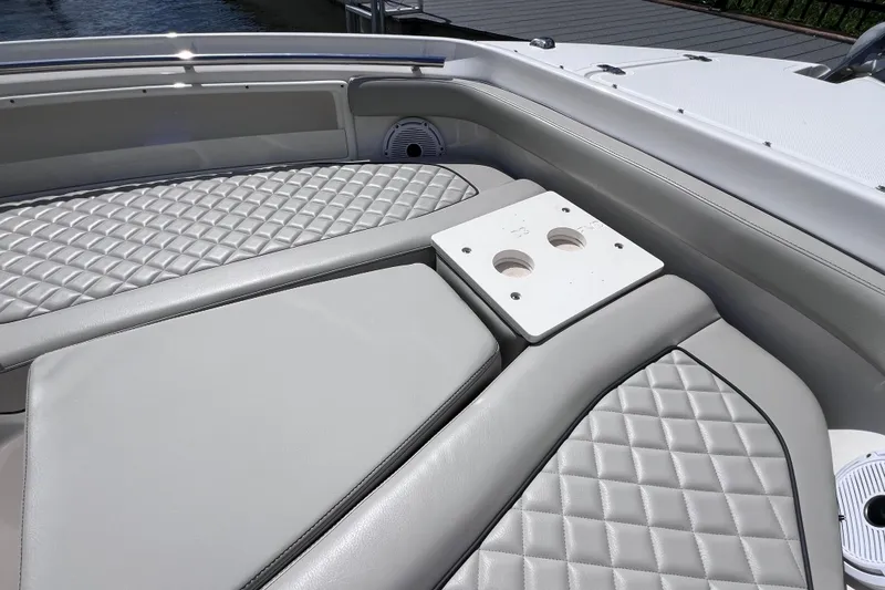 Slide: The Image of Luxurious seating on 2022 Pursuit DC 246 Dual Console boat with quilted upholstery. - 59