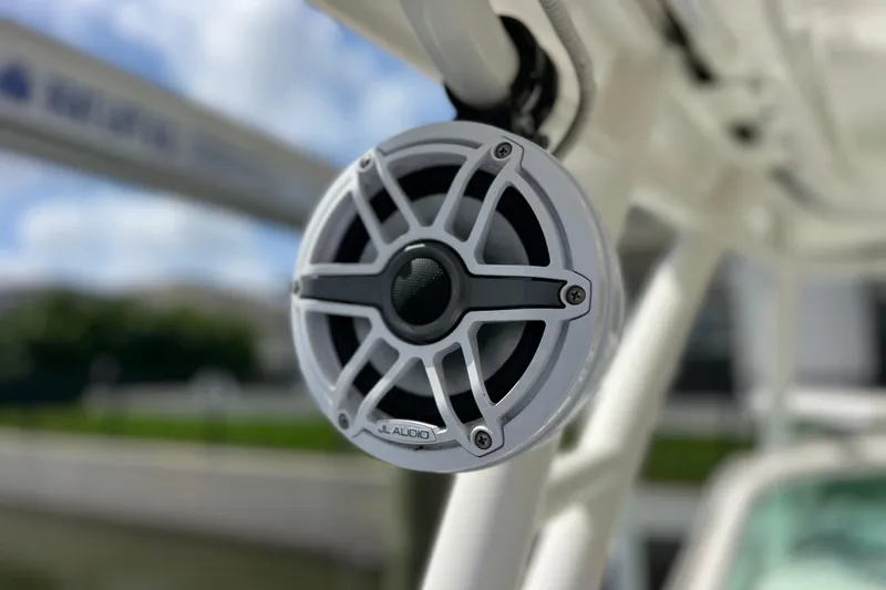Slide: The Image of Close-up of JL Audio speaker on 2022 Pursuit DC 246 Dual Console boat. - 66
