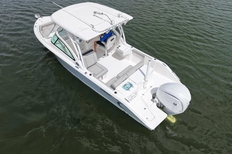 Slide: The Image of 2022 Pursuit DC 246 Dual Console boat on water, aerial view. - 7