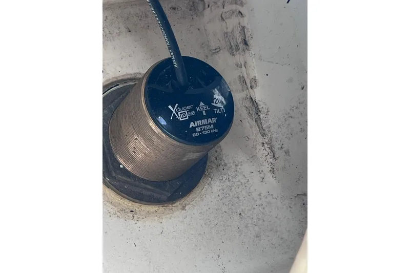 Slide: The Image of Airmar B75M transducer installed on 2022 Pursuit DC 246 Dual Console boat. - 72