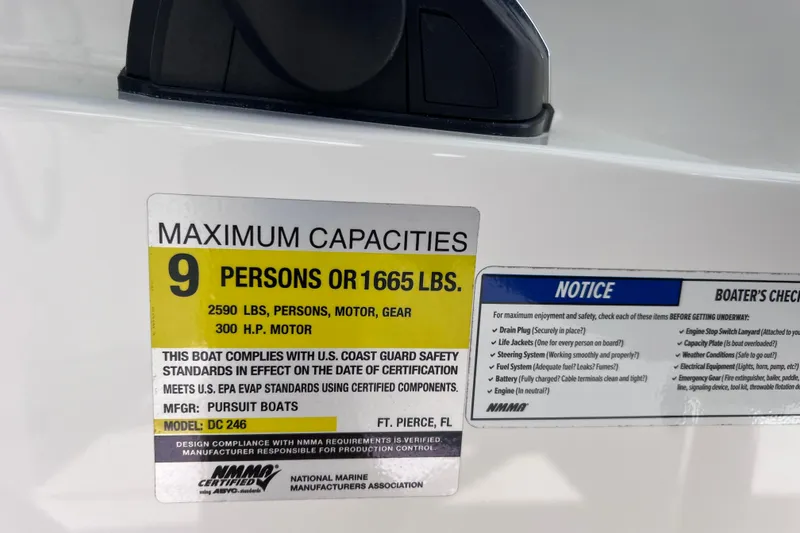 Slide: The Image of 2022 Pursuit DC 246 Dual Console capacity label, 9 persons or 1665 lbs, 300 HP motor. - 73