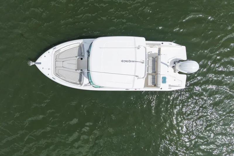 Slide: The Image of Overhead view of 2022 Pursuit DC 246 Dual Console boat on water. - 8
