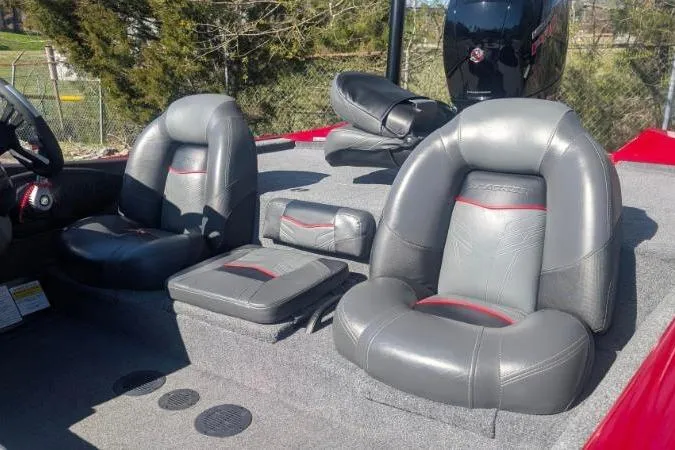 Slide: The Image of 2022 Tracker Pro Team 195 TXW Tournament Edition boat interior with gray seating. - 2
