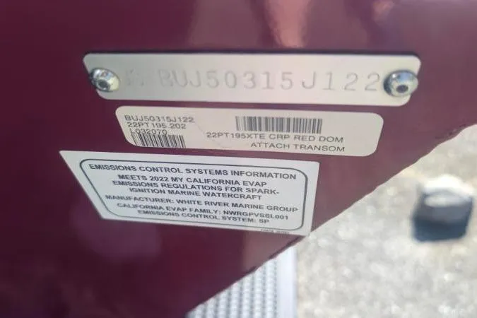 Slide: The Image of 2022 Tracker Pro Team 195 TXW Tournament Edition emissions control label on red transom. - 8