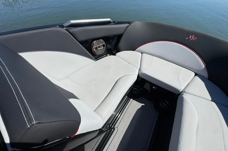 Slide: The Image of 2019 MasterCraft XT22 boat interior with sleek seating and modern design. - 12