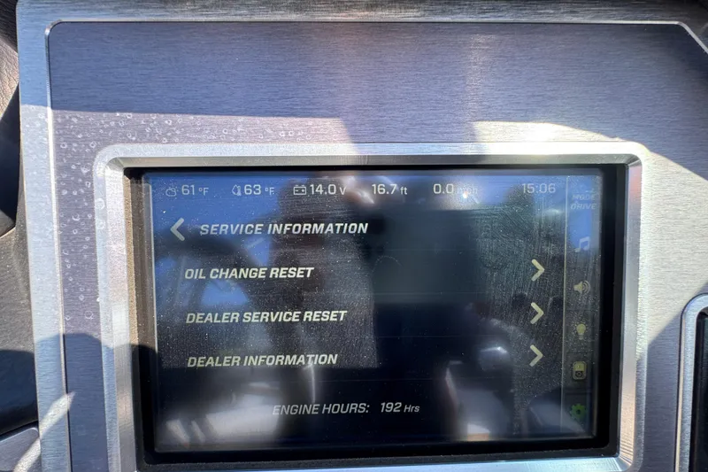 Slide: The Image of 2019 MasterCraft XT22 dashboard displaying service information and engine hours. - 17