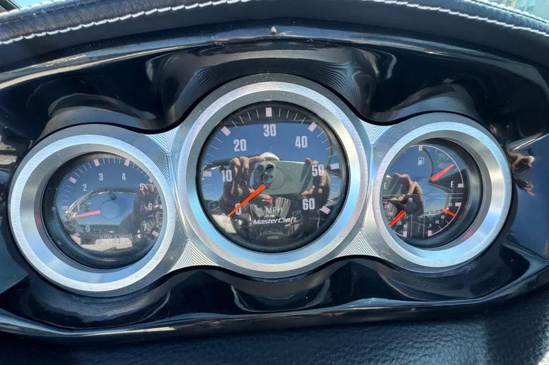 Slide: The Image of Dashboard of 2019 MasterCraft XT22 boat with speedometer and gauges. - 19