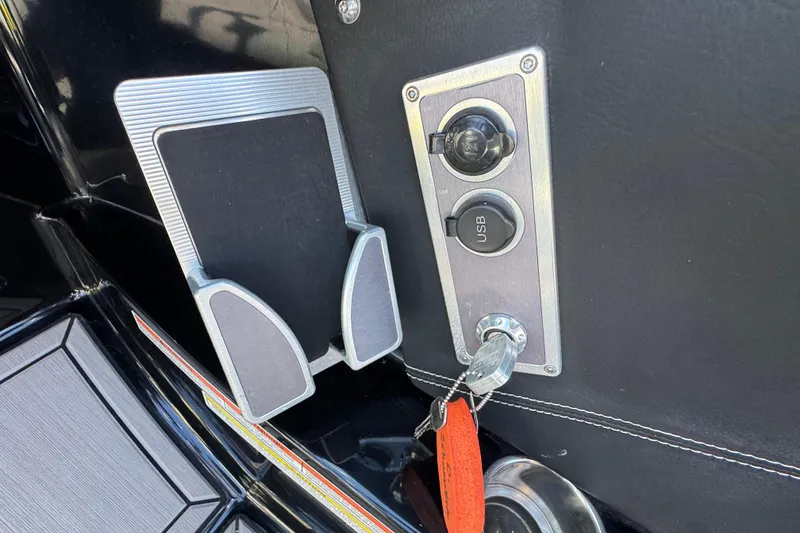 Slide: The Image of 2019 MasterCraft XT22 dashboard with USB port and key ignition. - 20