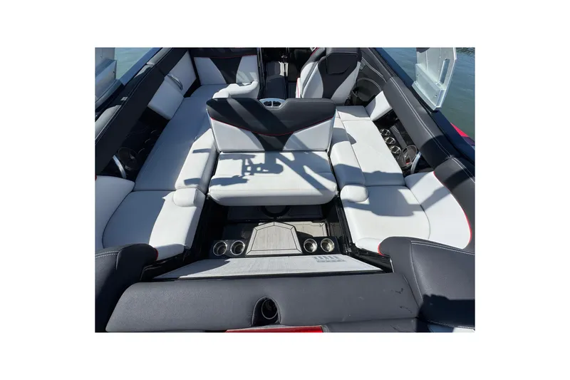 Slide: The Image of 2019 MasterCraft XT22 boat interior with luxurious seating and cup holders. - 28