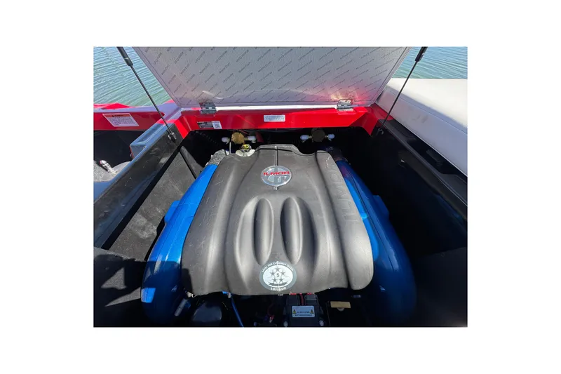 Slide: The Image of 2019 MasterCraft XT22 engine compartment with open hatch, showcasing powerful engine components. - 29