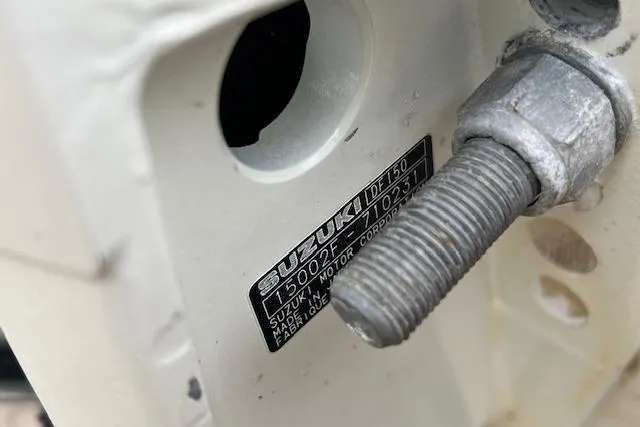 Slide: The Image of Close-up of Suzuki DF150 engine label on 2004 Hydra-Sports Lightning 212 WA boat. - 10