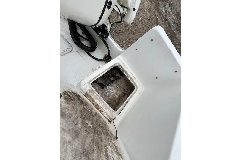 Slide: The Image of 2004 Hydra-Sports Lightning 212 WA boat interior with open storage compartment. - 11