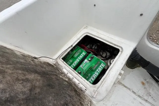Slide: The Image of 2004 Hydra-Sports Lightning 212 WA boat battery compartment with Interstate batteries. - 12