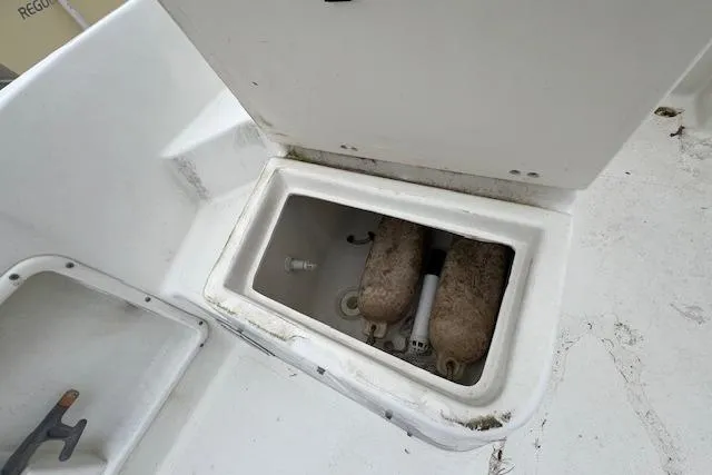 Slide: The Image of 2004 Hydra-Sports Lightning 212 WA boat storage compartment with fenders inside. - 13