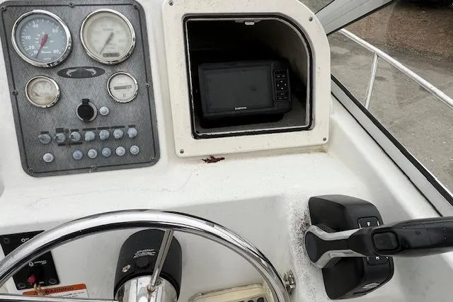 Slide: The Image of 2004 Hydra-Sports Lightning 212 WA dashboard with gauges and navigation equipment. - 15