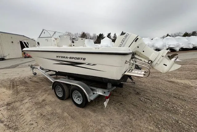 Slide: The Image of 2004 Hydra-Sports Lightning 212 WA boat on trailer, parked outdoors. - 4