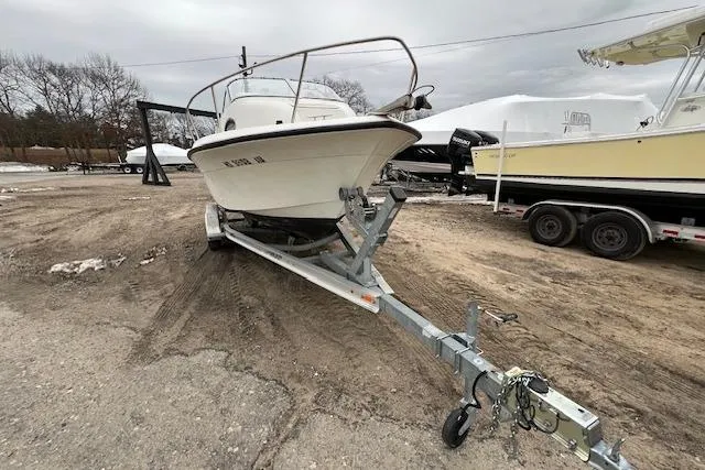 Slide: The Image of 2004 Hydra-Sports Lightning 212 WA boat on trailer in outdoor storage area. - 7