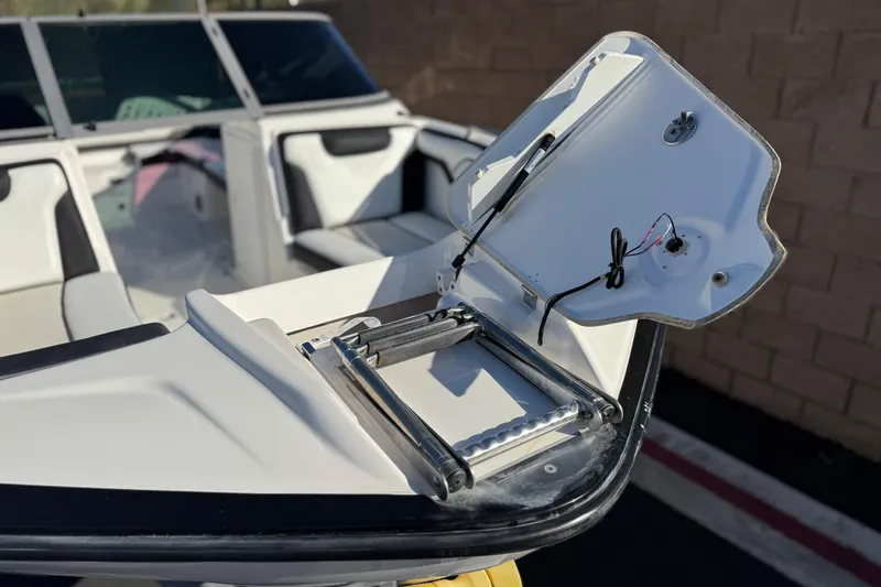 Slide: The Image of 2018 Yamaha AR210 boat with open hatch and seating area. - 12