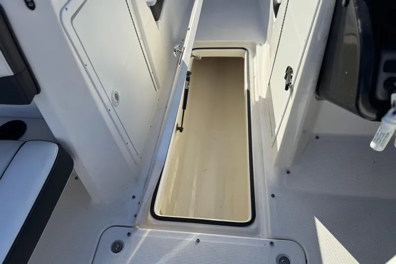 Slide: The Image of 2018 Yamaha AR210 boat storage compartment with open hatch. - 17