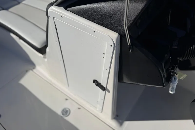 Slide: The Image of 2018 Yamaha Boats AR210 interior detail with seating and control panel. - 25