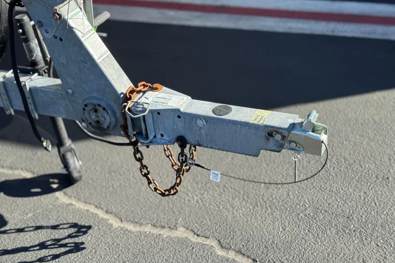 Slide: The Image of Trailer hitch of a 2018 Yamaha Boats AR210 on asphalt pavement. - 27