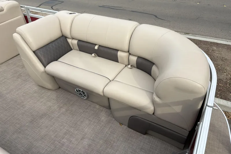 Slide: The Image of 2024 Sun Tracker Party Barge 20 DLX, beige seating, luxurious pontoon interior. - 10