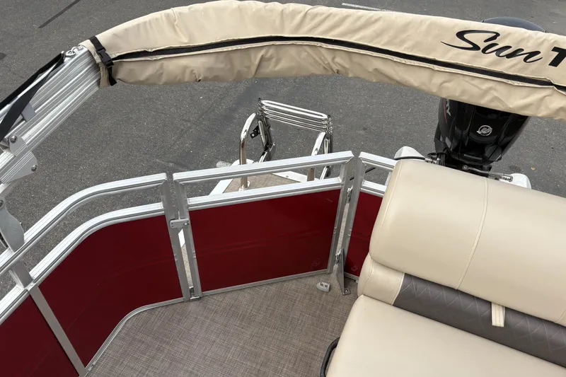 Slide: The Image of 2024 Sun Tracker Party Barge 20 DLX pontoon boat interior with seating and railing. - 18