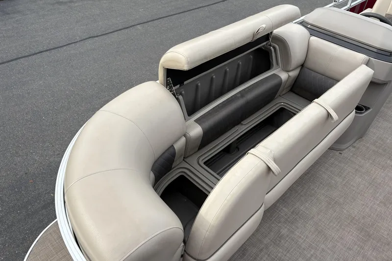 Slide: The Image of 2024 Sun Tracker Party Barge 20 DLX seating with open storage compartments. - 24