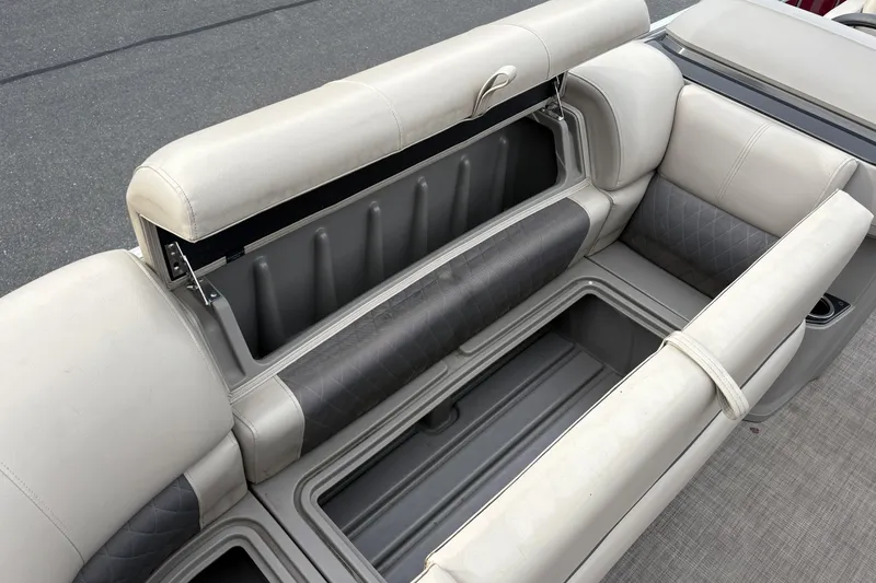 Slide: The Image of 2024 Sun Tracker Party Barge 20 DLX storage compartments with cushioned seating. - 27