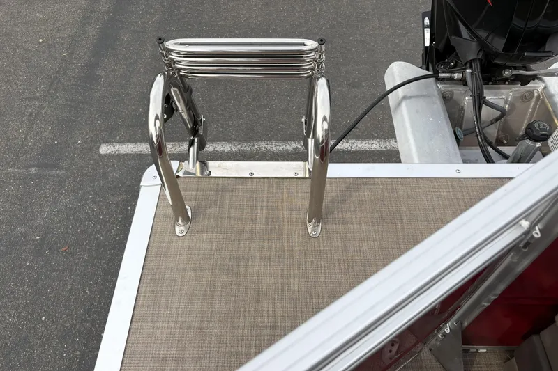 Slide: The Image of 2024 Sun Tracker Party Barge 20 DLX with stainless steel swim ladder on deck. - 29