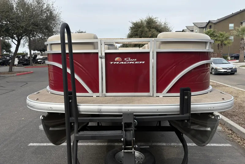 Slide: The Image of 2024 Sun Tracker Party Barge 20 DLX pontoon boat in parking lot. - 7