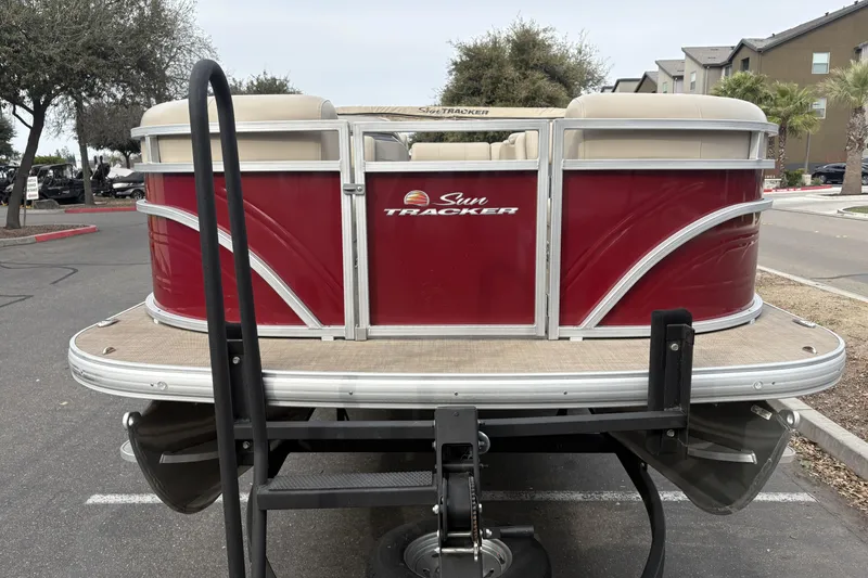 Slide: The Image of 2024 Sun Tracker Party Barge 20 DLX pontoon boat in parking lot. - 8