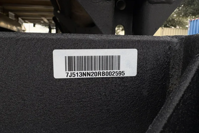 Slide: The Image of Barcode label on 2024 Sun Tracker Party Barge 20 DLX boat trailer. - 88